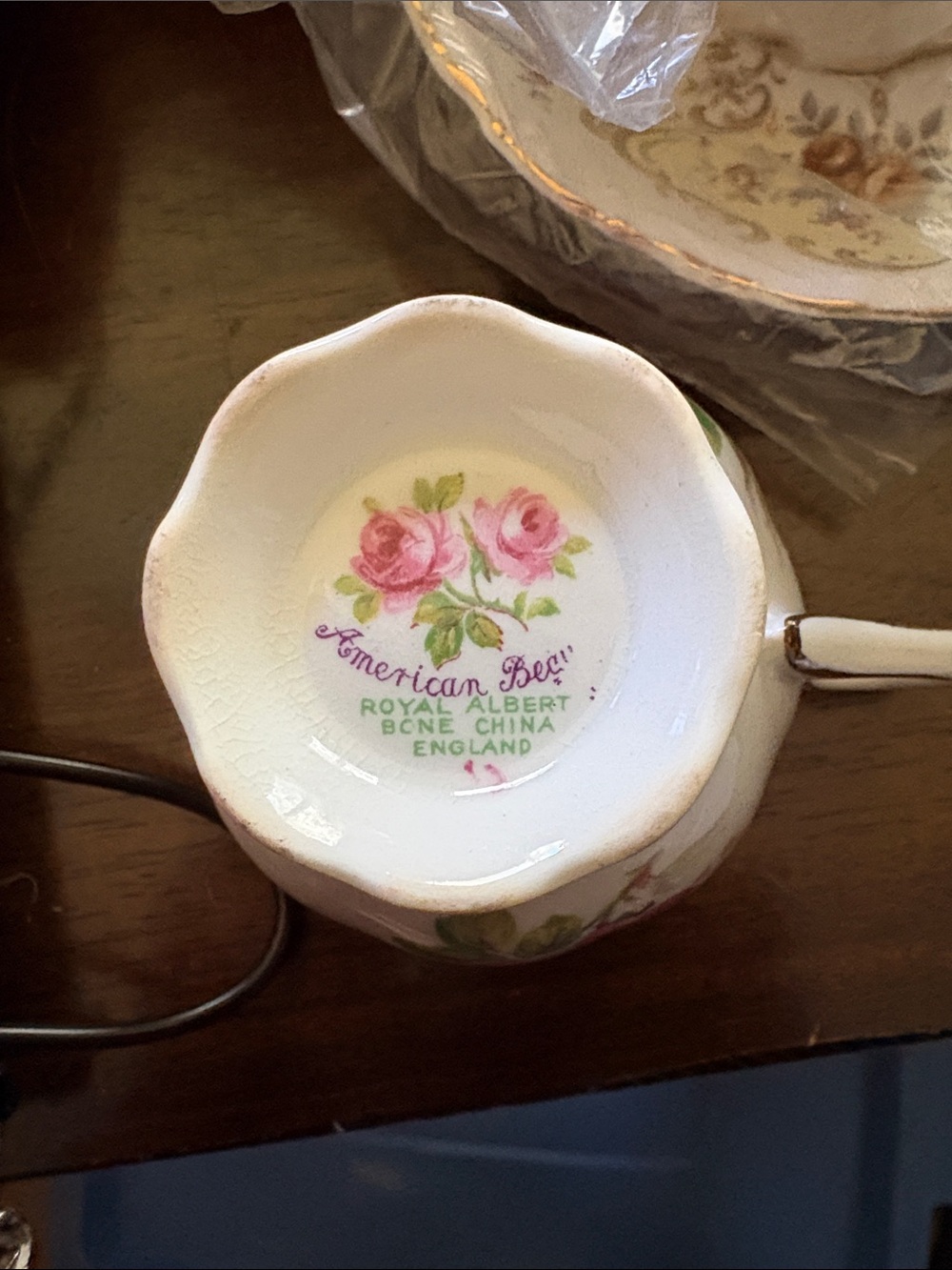 Lot
Royal Albert American Beauty Porcelain Tea Cup & Saucer Set with Gold Tri